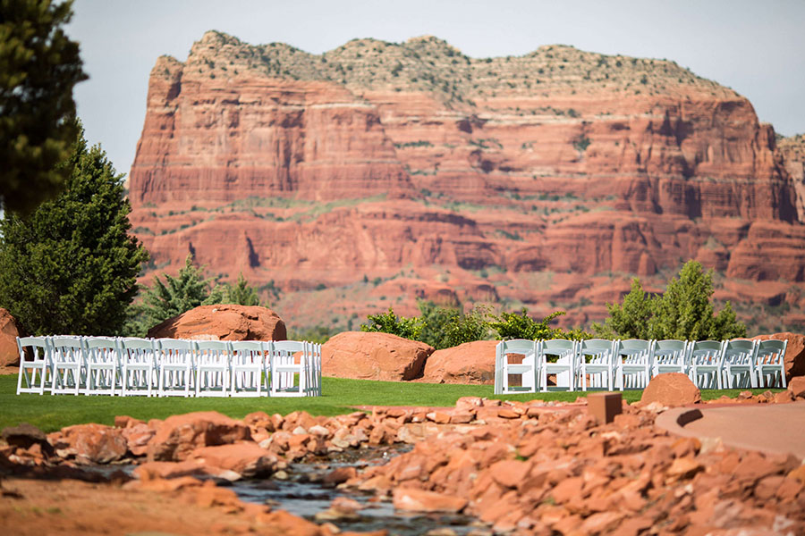 Elegant ceremony setup at Sedona Golf Resort, featuring arranged chairs and a picturesque natural backdrop.